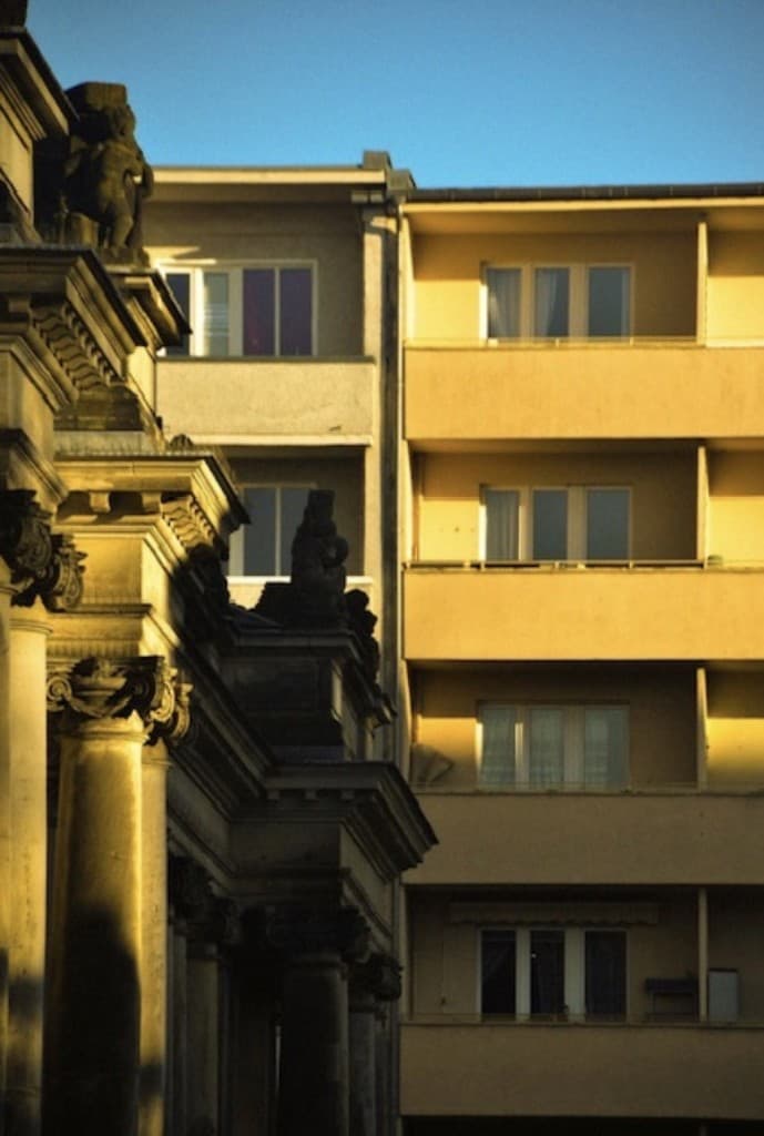 German classical columns and modern apartment facade in an urban setting
