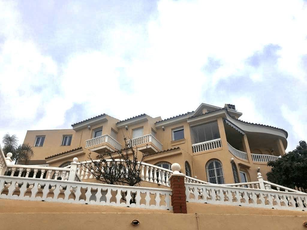 Spanish Mediterranean villa with terracotta roofs and terraces