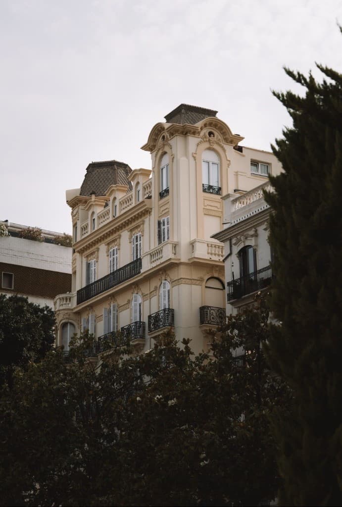Elegant Spanish neoclassical building with mansard roof towers