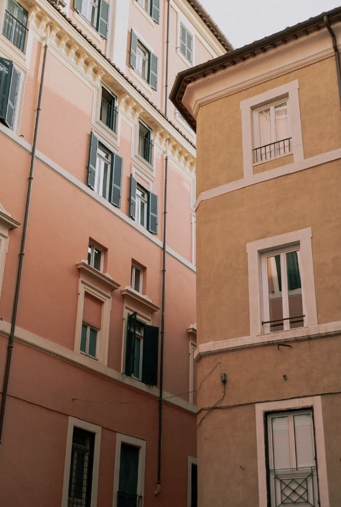 Italian salmon and ochre building facades on a narrow street